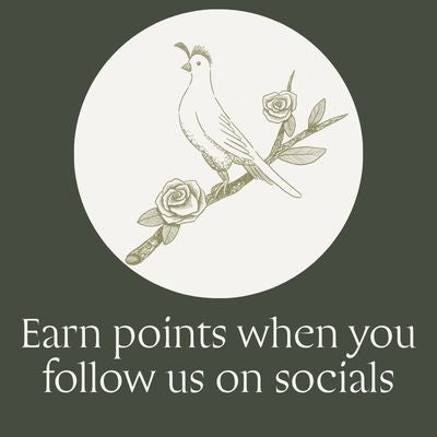 A square promotional graphic with a dark olive-green background, a large off-white oval in the center containing a delicate line drawing of a bird perched on a branch with roses, and the text below reading 'Earn points when you follow us on socials"