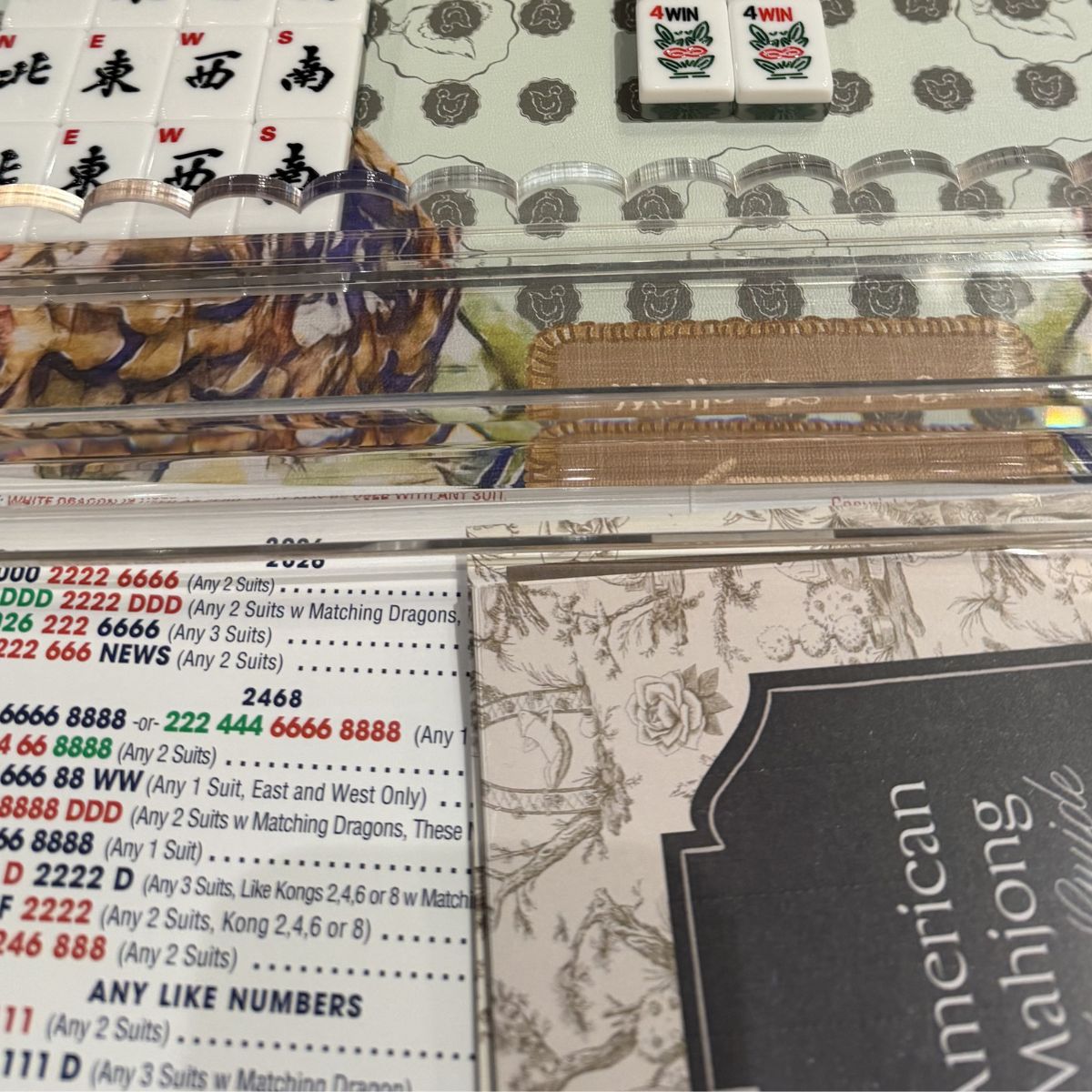Close-up of a mahjong set with tiles and the National American Mahjong League card at The Pepper Pot in Barrington, IL.