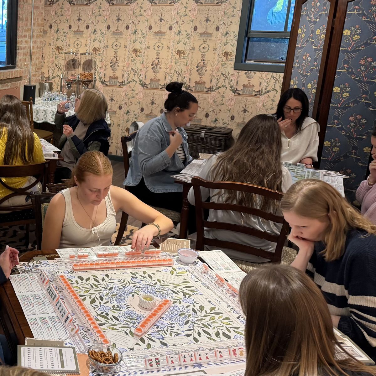 Group of people playing a American Mahjong in The Drawing Room room at The Pepper Pot in Barrington, IL