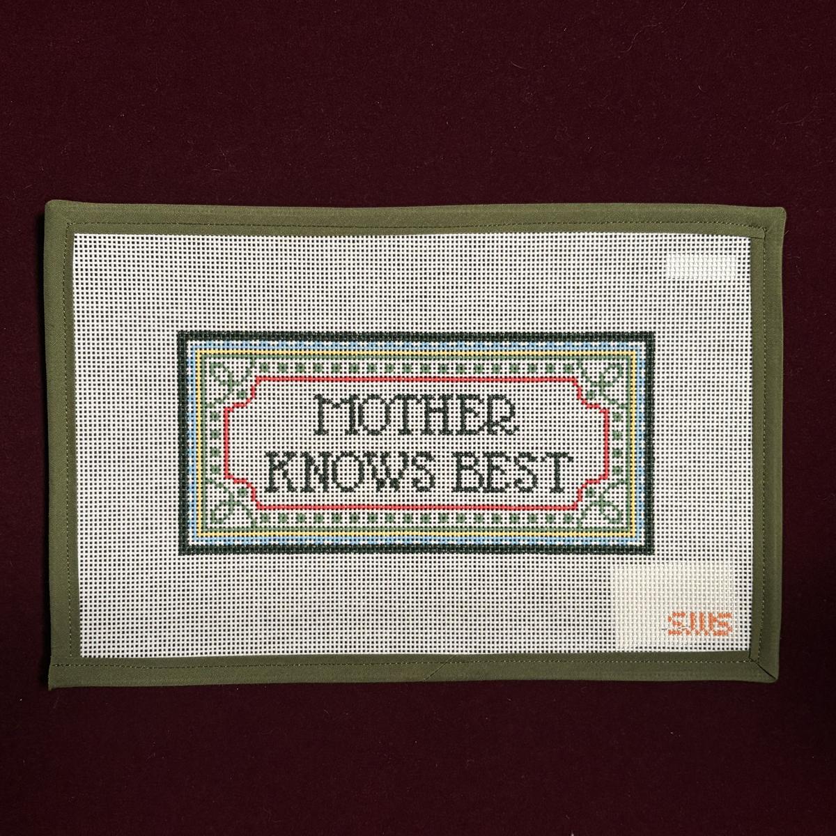 Needlepoint Canvas  with 'Mother Knows Best' text on a white background, framed in green.