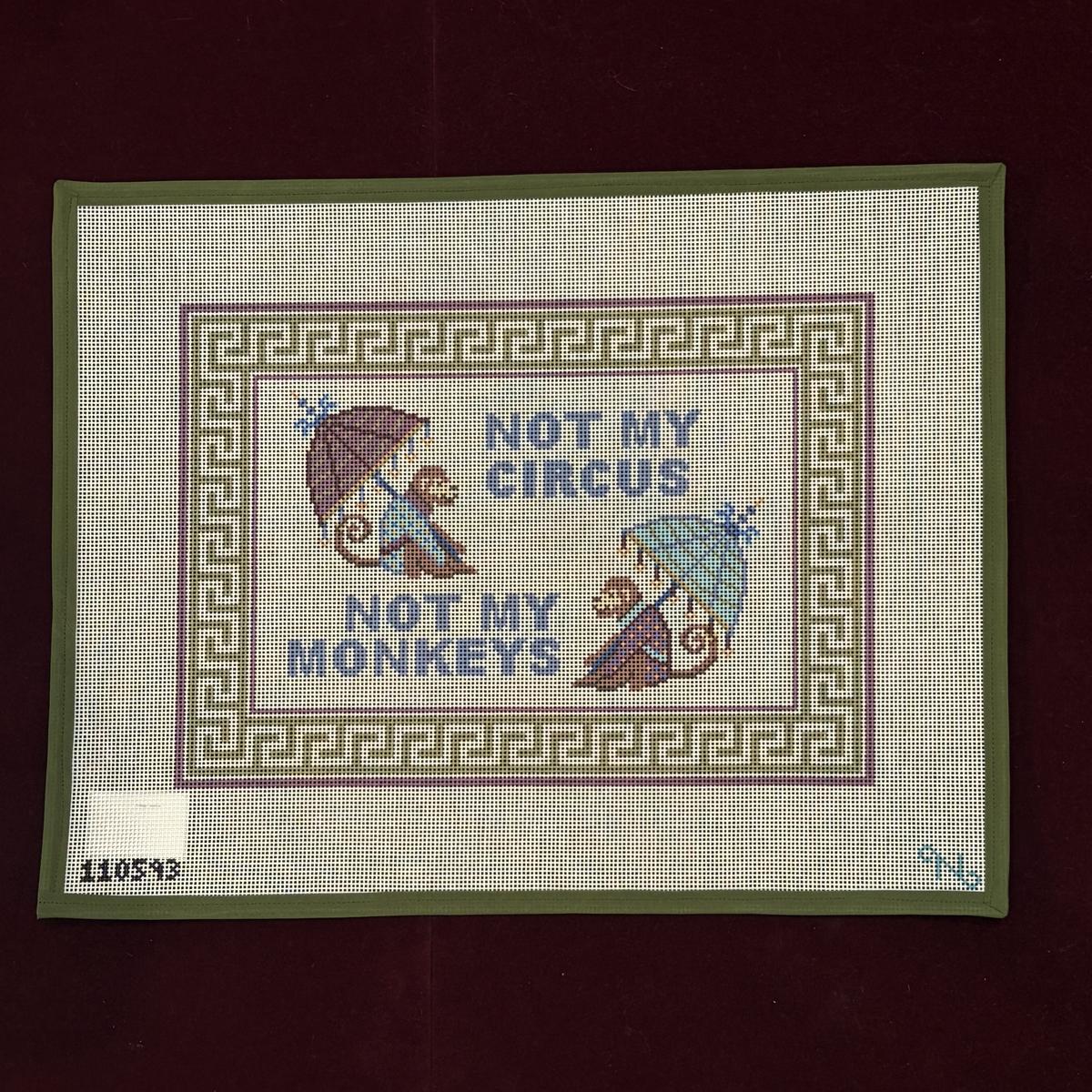Needlepoint canvas design with monkeys holding umbrellas and 'Not my circus, not my monkeys' text on a patterned background.