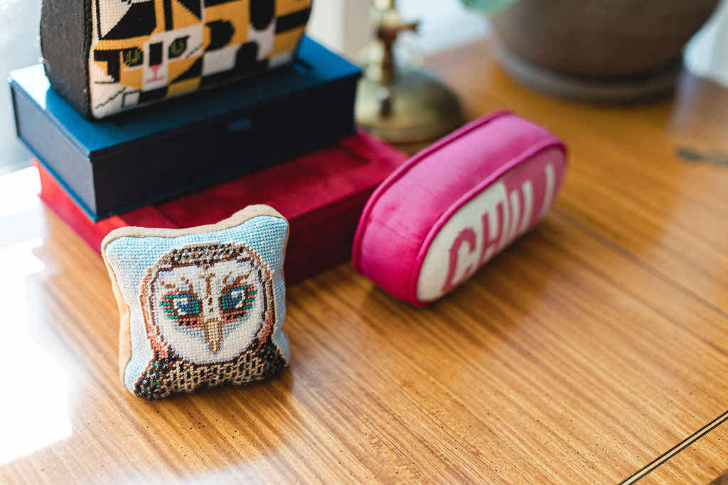 Decorative needlepoint door weights and bookends with owl design on a wooden surface.  | The Pepper Pot Barrington, IL 