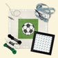 Cross-stitching kit with a soccer ball design on fabric, thread, scissors, and a hoop.